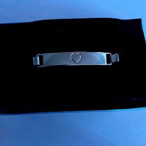 A Mixit Luxe bracelet that is cute with a heart
